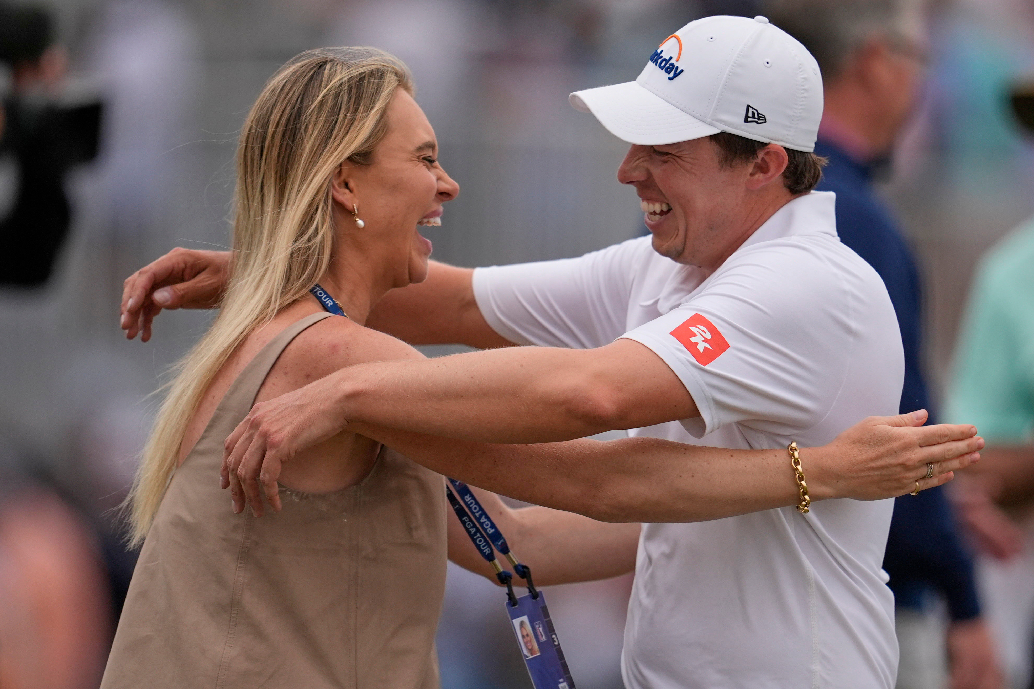 Matt Fitzpatrick, of England, right, hugs his wife Katherine Gaal after winning the RBC Heritage golf tournament Sunday, April 19, 2026, in Hilton Head, S.C. 