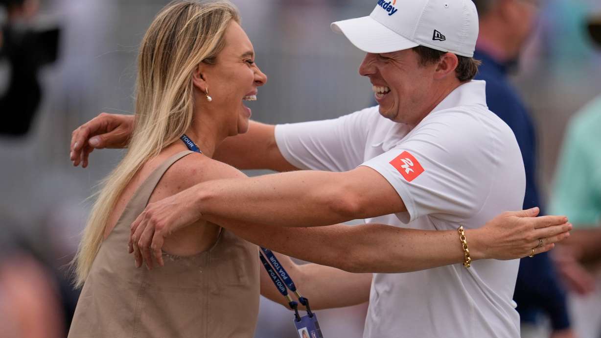 Matt Fitzpatrick, of England, right, hugs his wife Katherine Gaal after winning the RBC Heritage golf tournament Sunday, April 19, 2026, in Hilton Head, S.C.