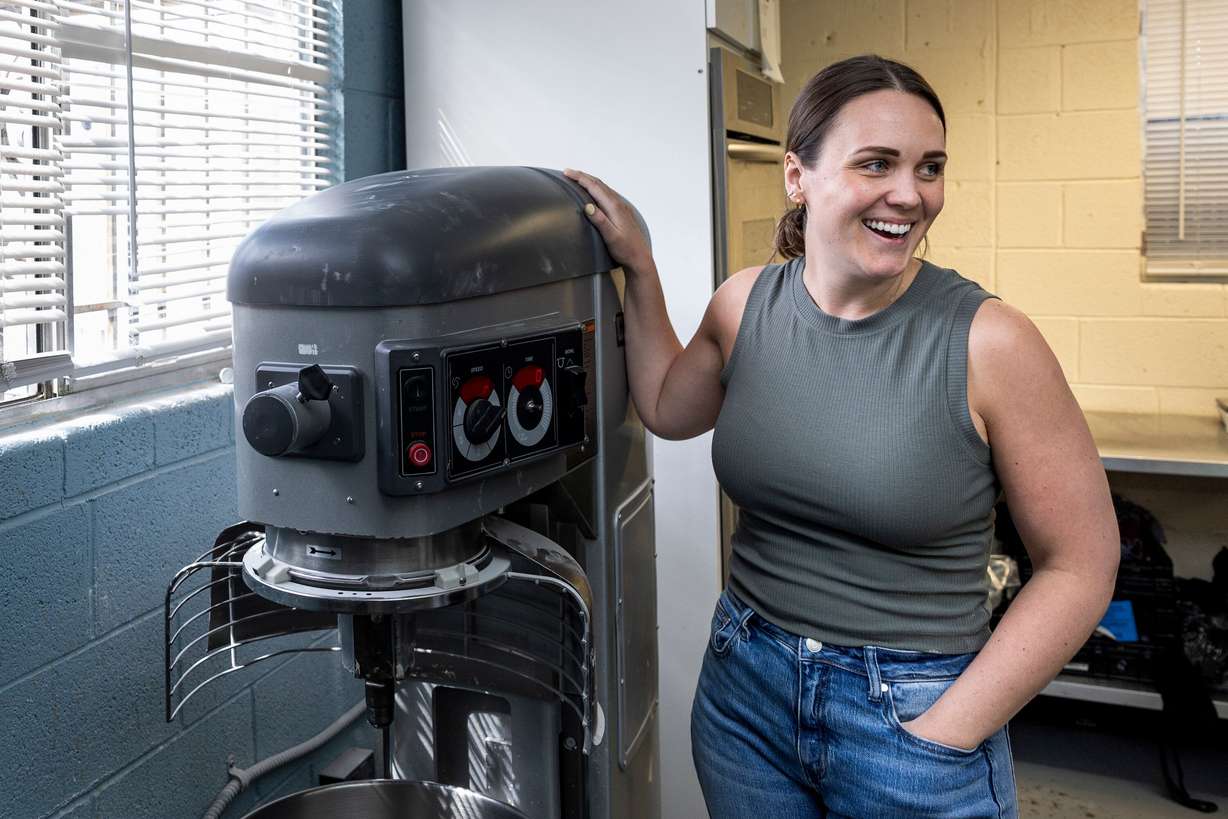 Amy Lund, co-founder and CEO of Dough Lady, stands next to one of the two stand mixers at Dough Lady in Millcreek on Thursday, April 9, 2026.