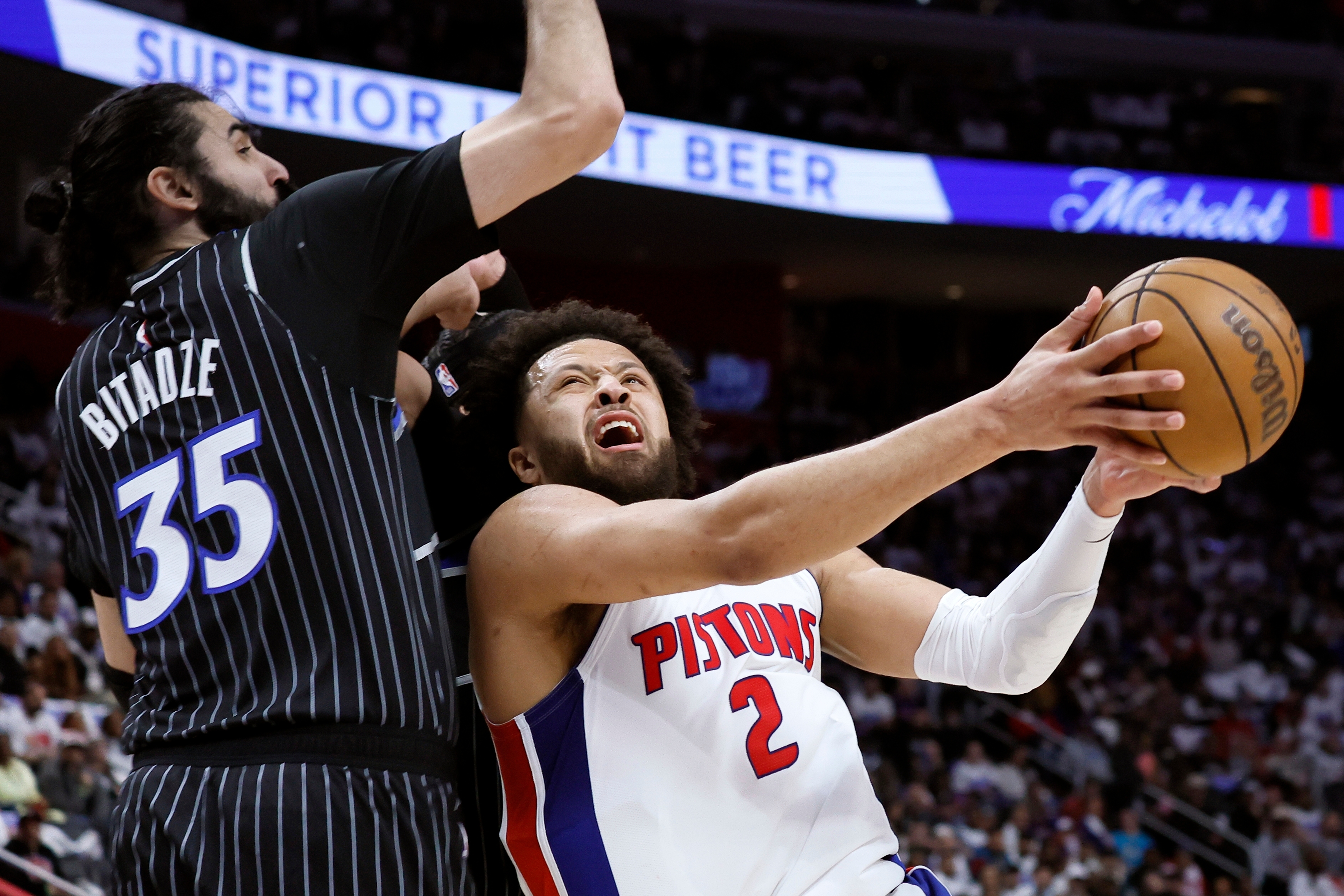 Detroit Pistons guard Cade Cunningham (2) goes to the basket against Orlando Magic center Goga Bitadze (35) during the first half in Game 1 of a first-round NBA basketball playoffs series Sunday, April 19, 2026, in Detroit. 