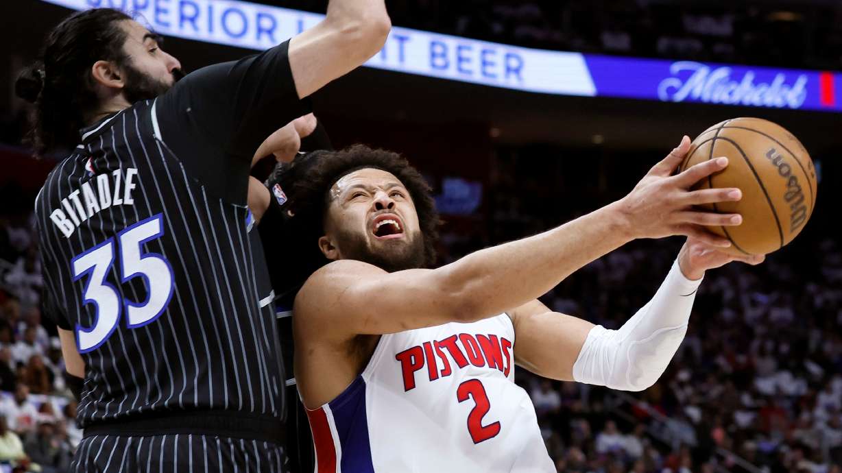 Detroit Pistons guard Cade Cunningham (2) goes to the basket against Orlando Magic center Goga Bitadze (35) during the first half in Game 1 of a first-round NBA basketball playoffs series Sunday, April 19, 2026, in Detroit.