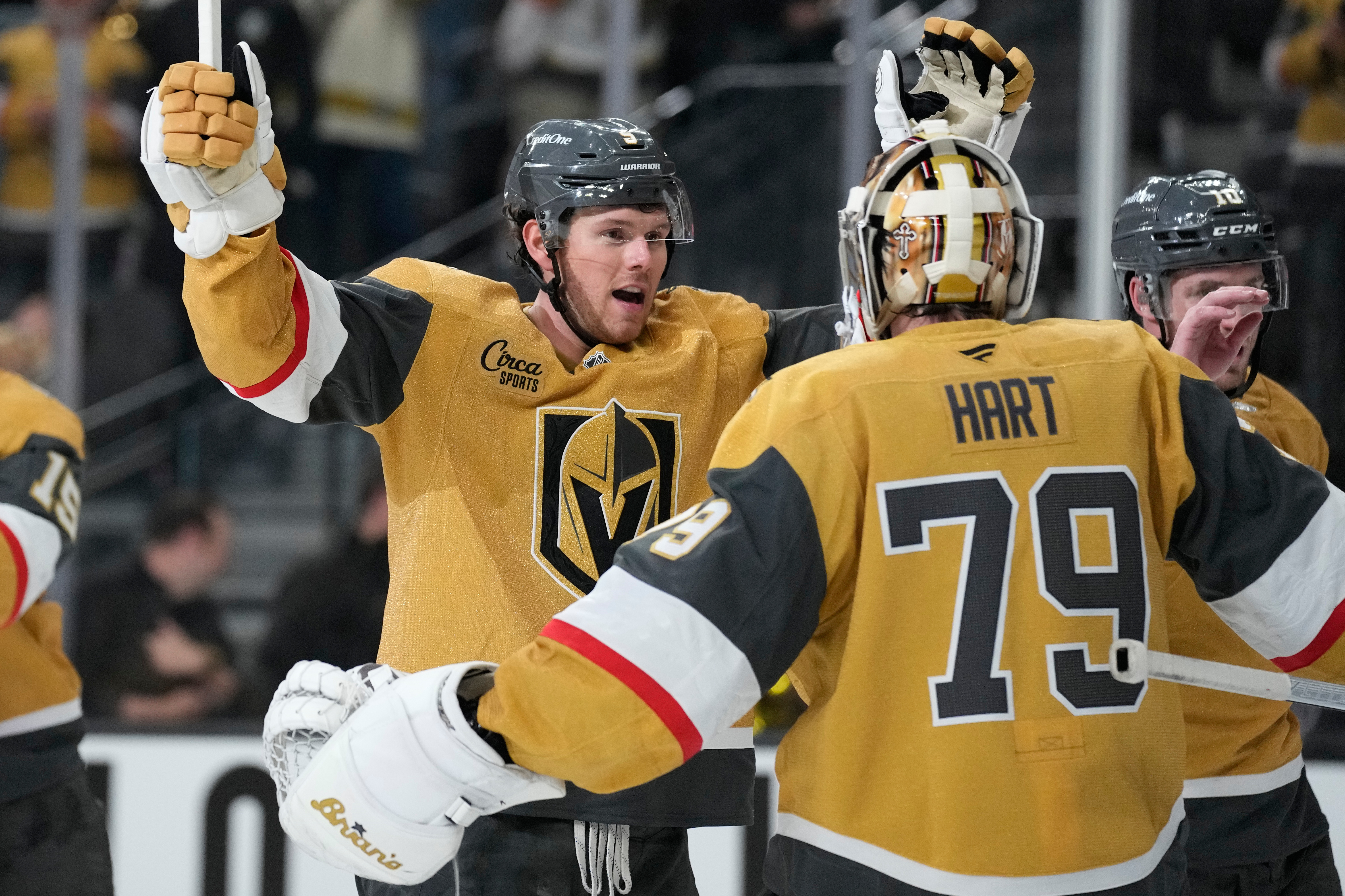 Vegas Golden Knights defenseman Jeremy Lauzon, left, celebrates with Vegas Golden Knights goaltender Carter Hart (79) after defeating the Utah Mammoth in Game 1 of a first-round NHL hockey Stanley Cup playoff series Sunday, April 19, 2026, in Las Vegas. 