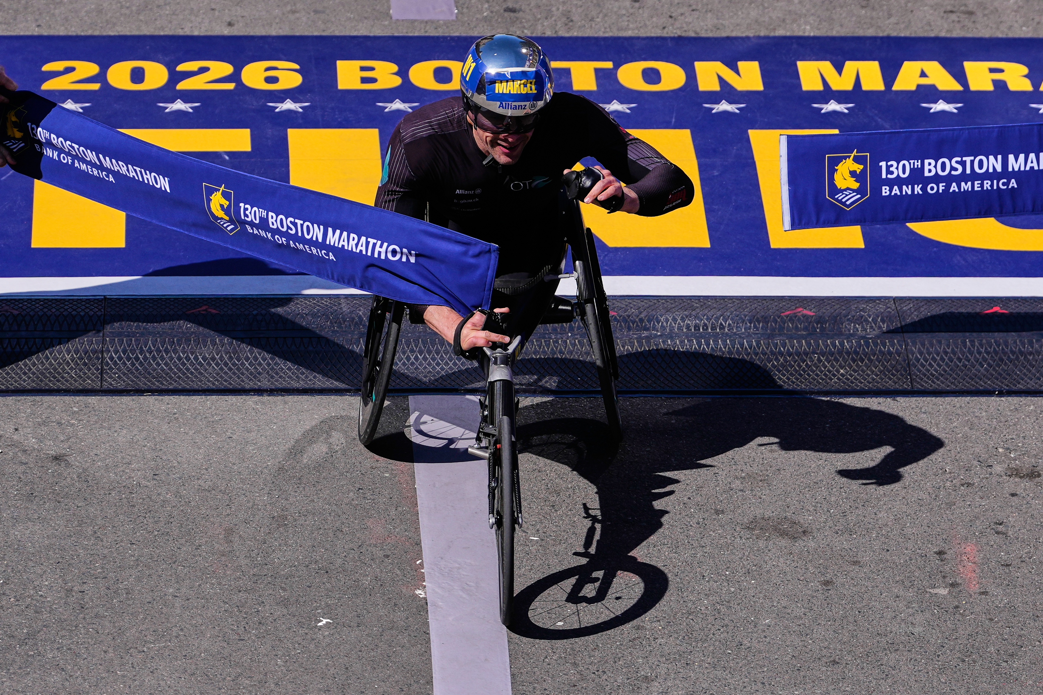 Switzerland great Marcel Hug claims his ninth Boston Marathon wheelchair title and fourth straight