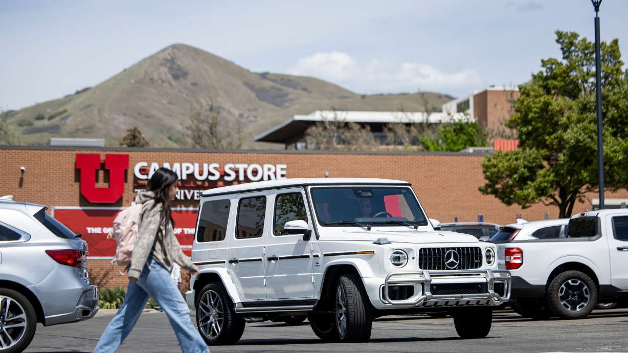 Cars navigate a busy parking lot at the University of Utah in Salt Lake City on Monday. The U. board of trustees last week approved a bond measure to fund an underground parking structure that will add approximately 1,500 spaces to campus.