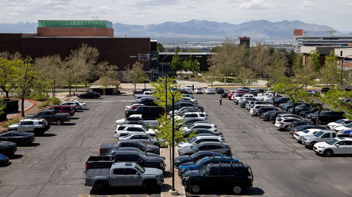 A student makes their way to their car at the University of Utah in Salt Lake City on April 20, 2026.