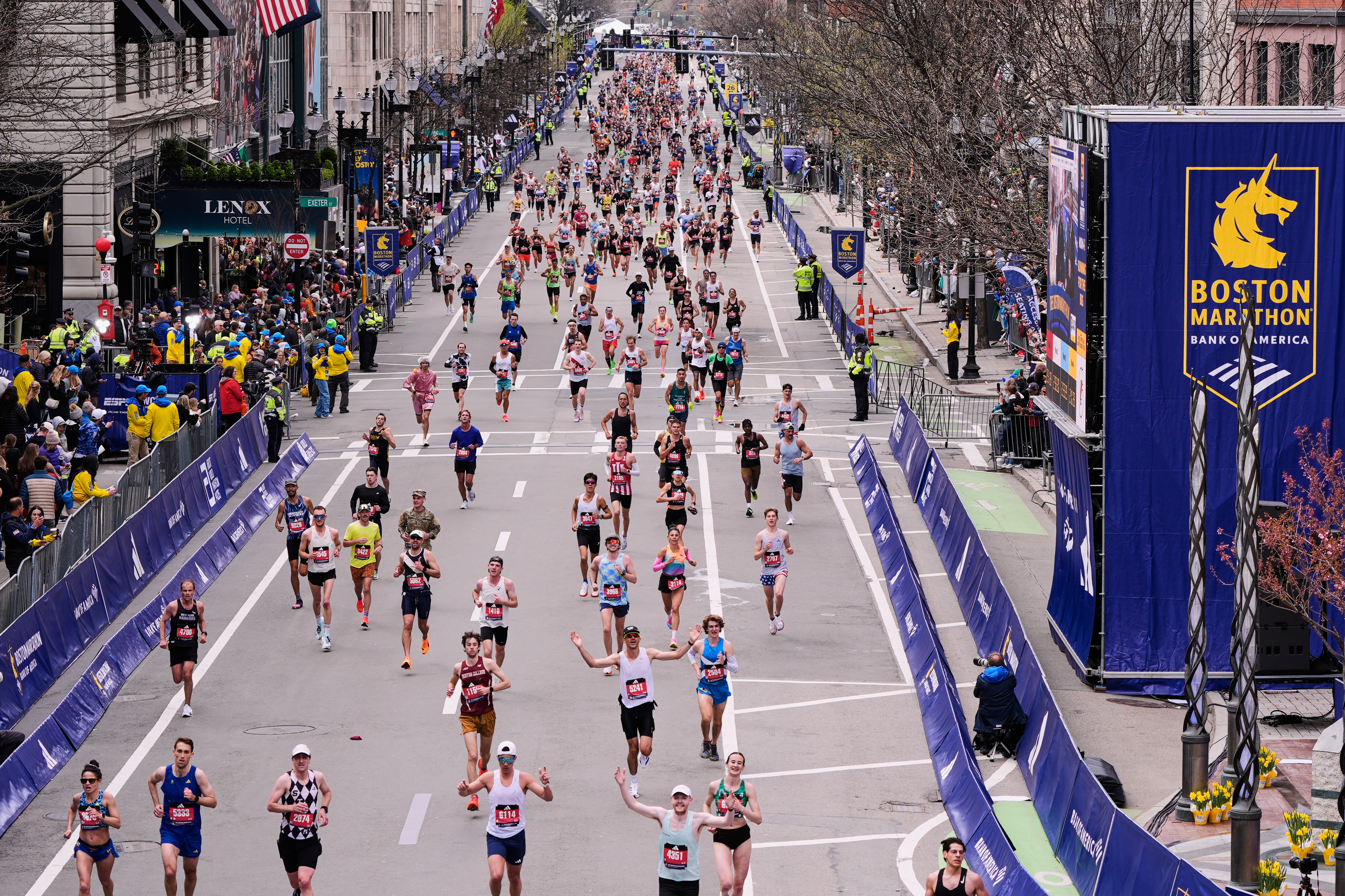 Runners stride down Boylston Street while approaching the finish line of the Boston Marathon, Monday, April 20, 2026, in Boston. 