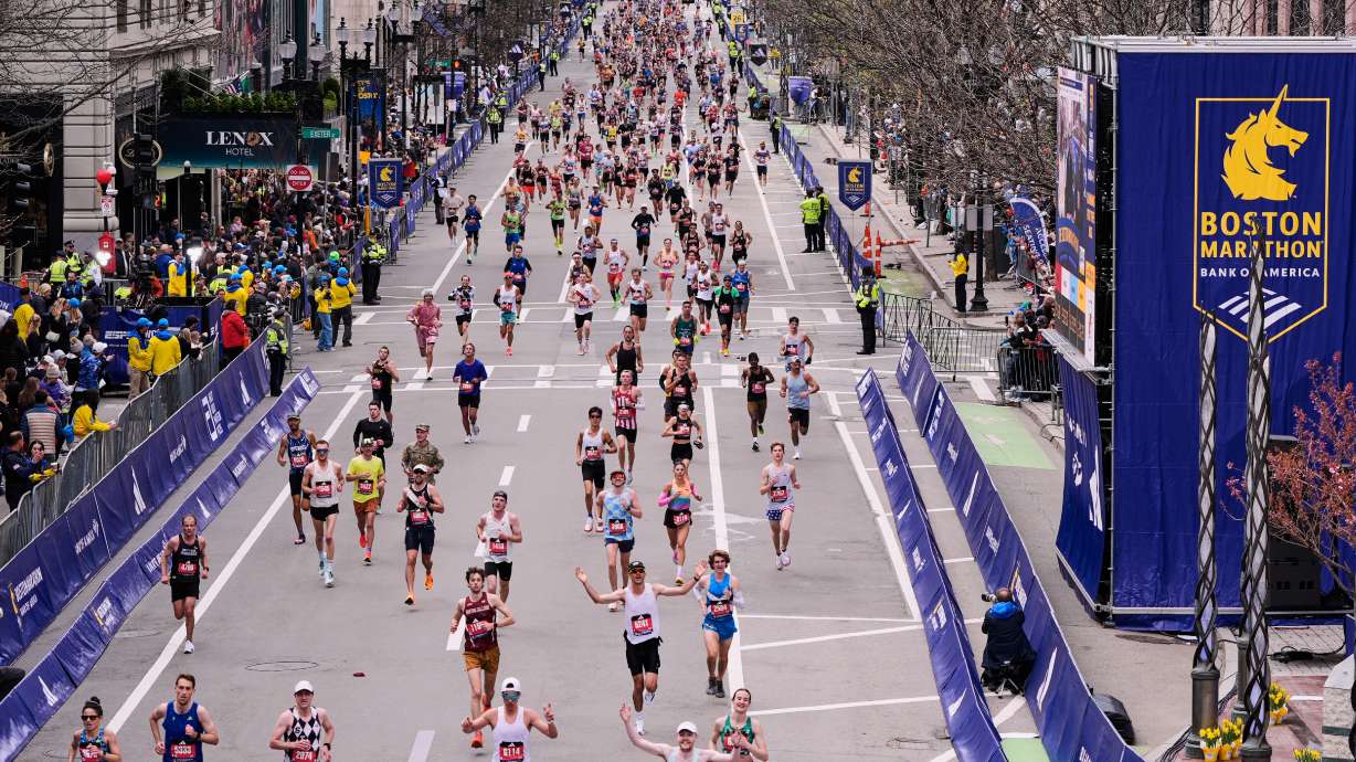 Runners stride down Boylston Street while approaching the finish line of the Boston Marathon, Monday, April 20, 2026, in Boston.
