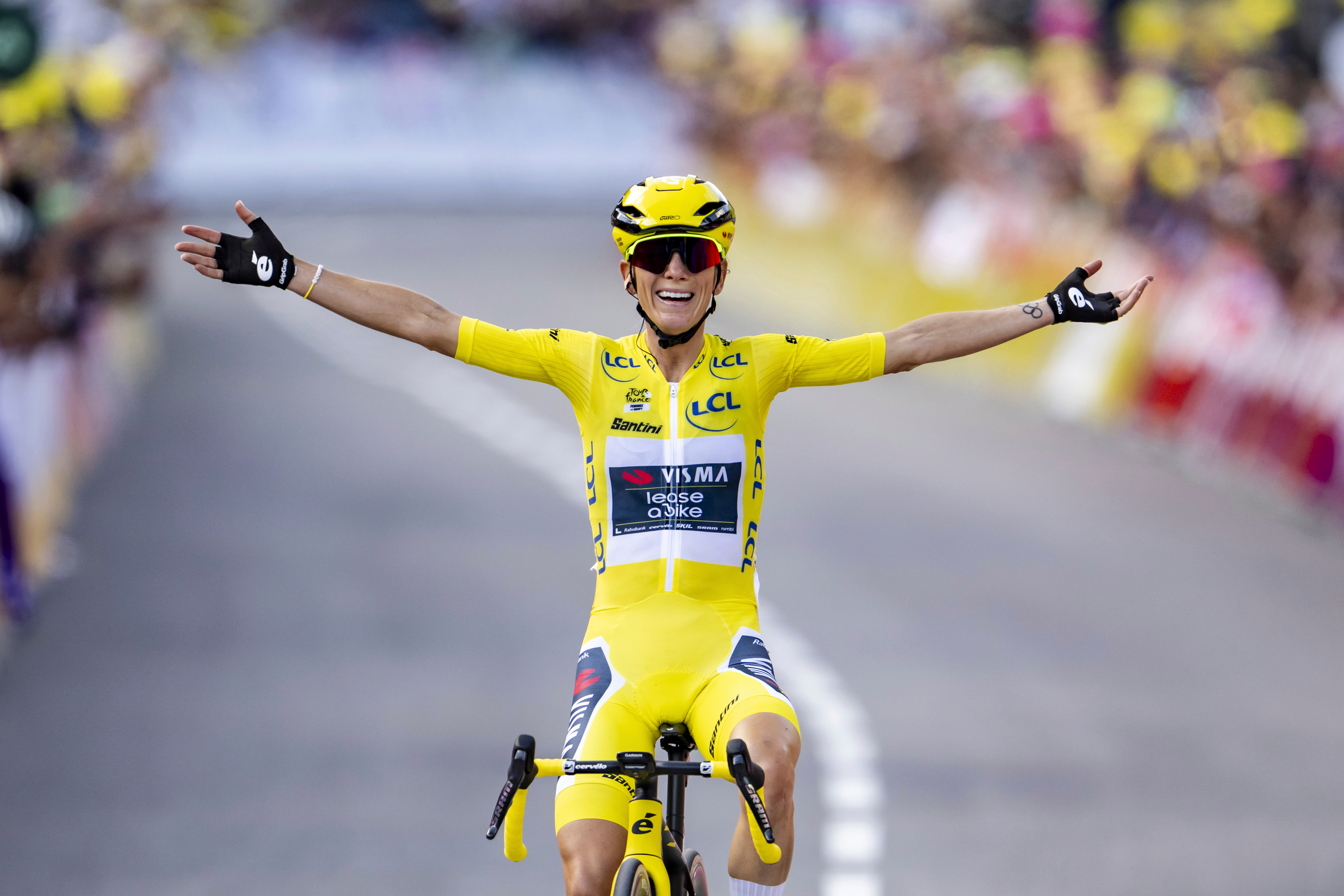 FILE - The winner of the Tour de France Femmes Pauline Ferrand-Prevot from France of team Visma - Lease a Bike celebrates as she crosses the finish line to win the 9th stage of the 4th edition of the Women's Tour de France cycling race in Chatel, France, Aug. 3, 2025. 