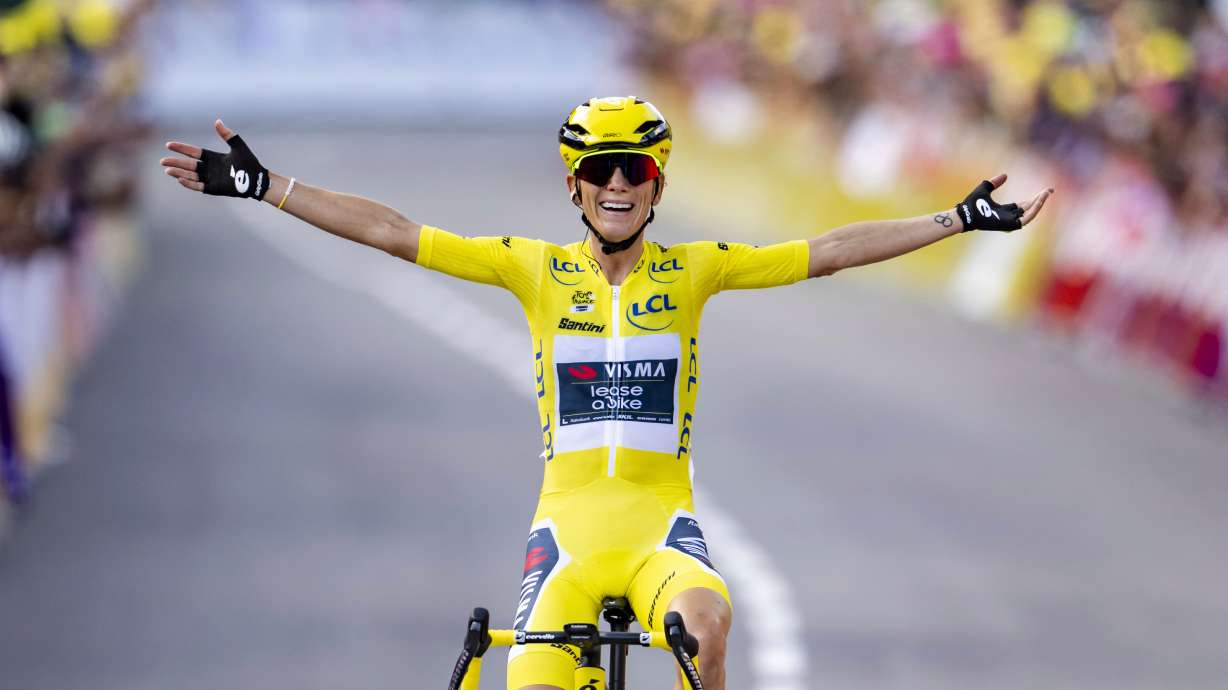 FILE - The winner of the Tour de France Femmes Pauline Ferrand-Prevot from France of team Visma - Lease a Bike celebrates as she crosses the finish line to win the 9th stage of the 4th edition of the Women's Tour de France cycling race in Chatel, France, Aug. 3, 2025.