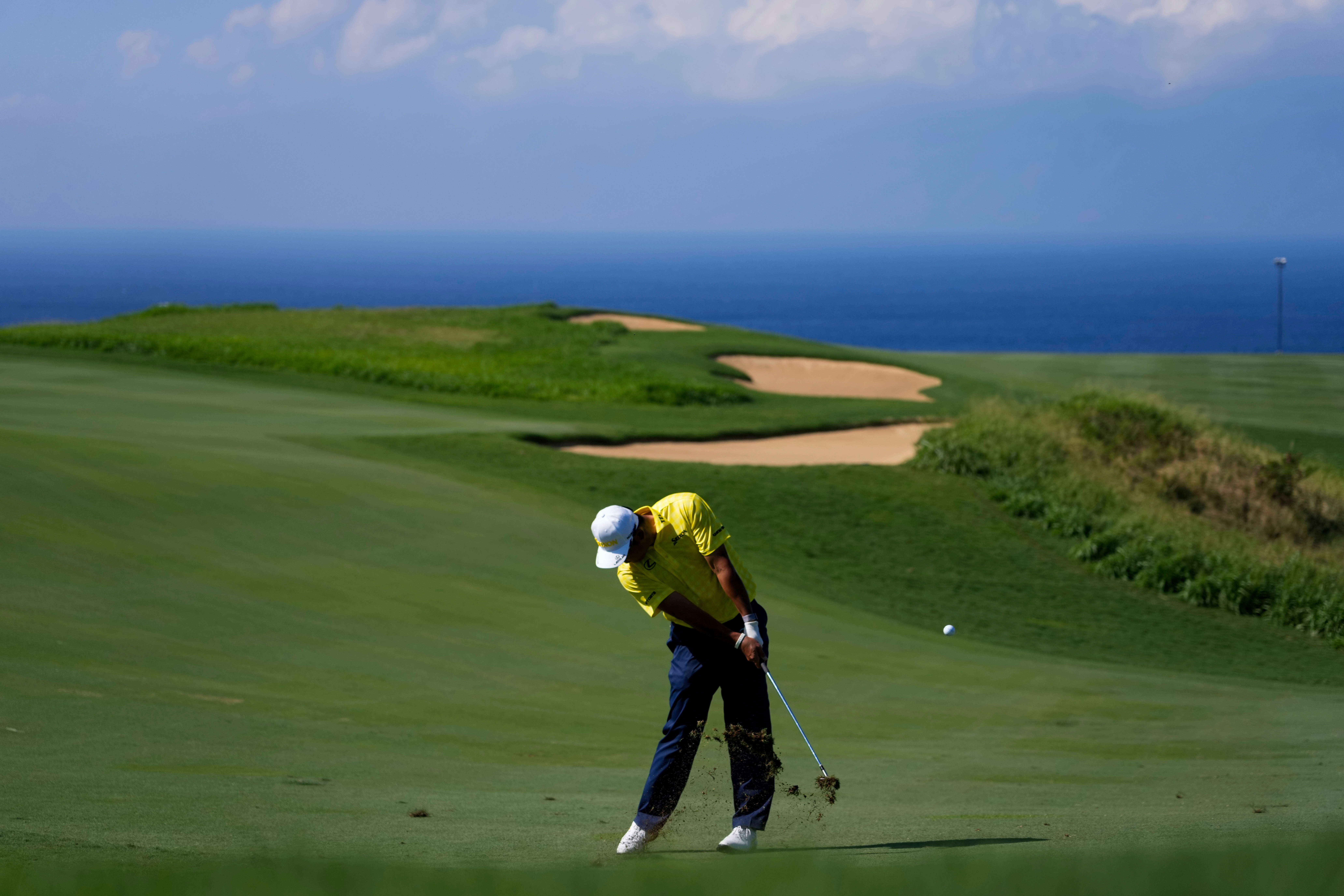 FILE - Hideki Matsuyama, of Japan, hits on the 13th hole during the final round of The Sentry golf event, Jan. 5, 2025, at Kapalua Plantation Course, in Kapalua, Hawaii. 