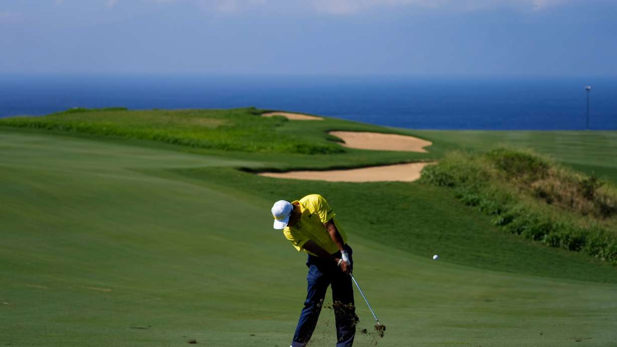 FILE - Hideki Matsuyama, of Japan, hits on the 13th hole during the final round of The Sentry golf event, Jan. 5, 2025, at Kapalua Plantation Course, in Kapalua, Hawaii.