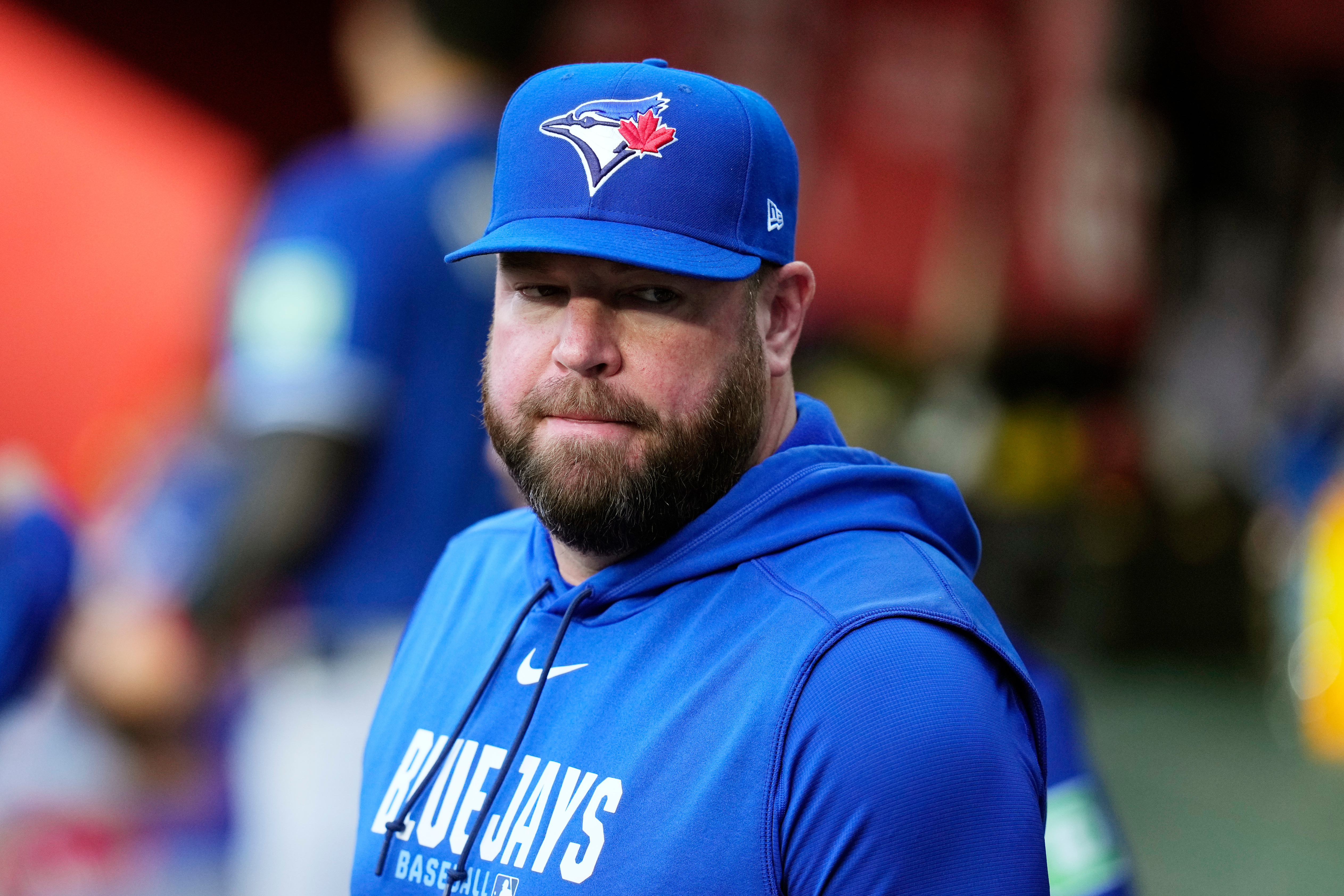 Toronto Blue Jays manager John Schneider pauses in the team dugout prior to a baseball game against the Arizona Diamondbacks, Saturday, April 18, 2026, in Phoenix. 