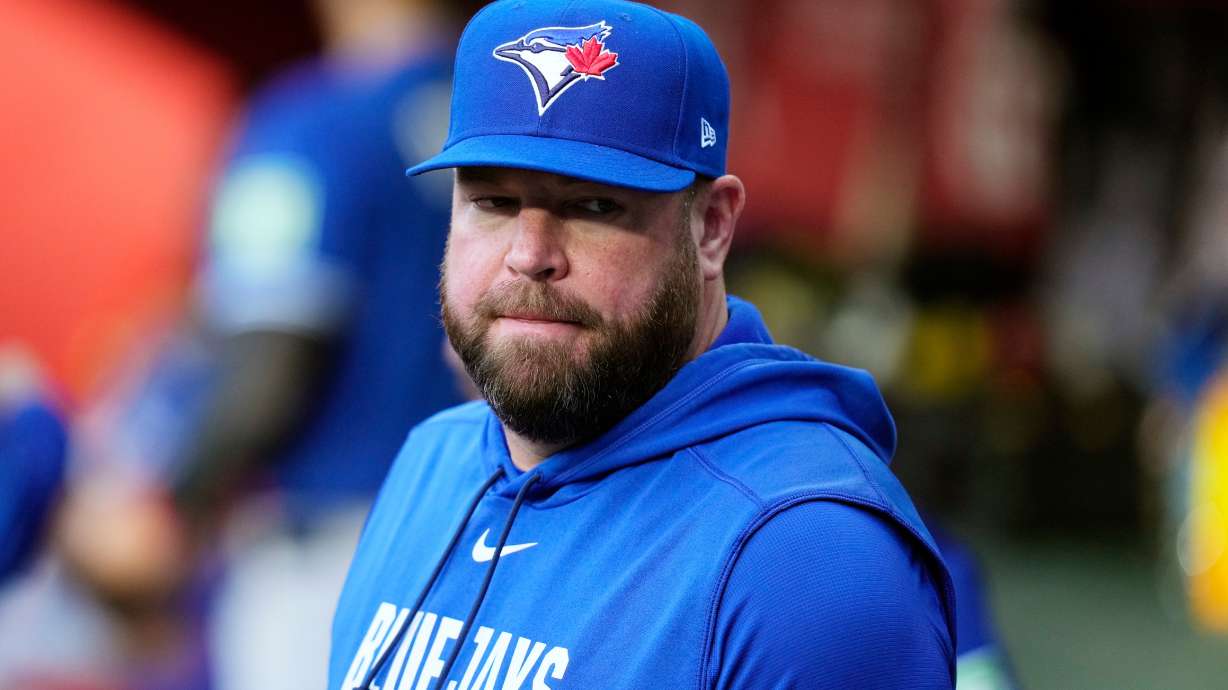 Toronto Blue Jays manager John Schneider pauses in the team dugout prior to a baseball game against the Arizona Diamondbacks, Saturday, April 18, 2026, in Phoenix.