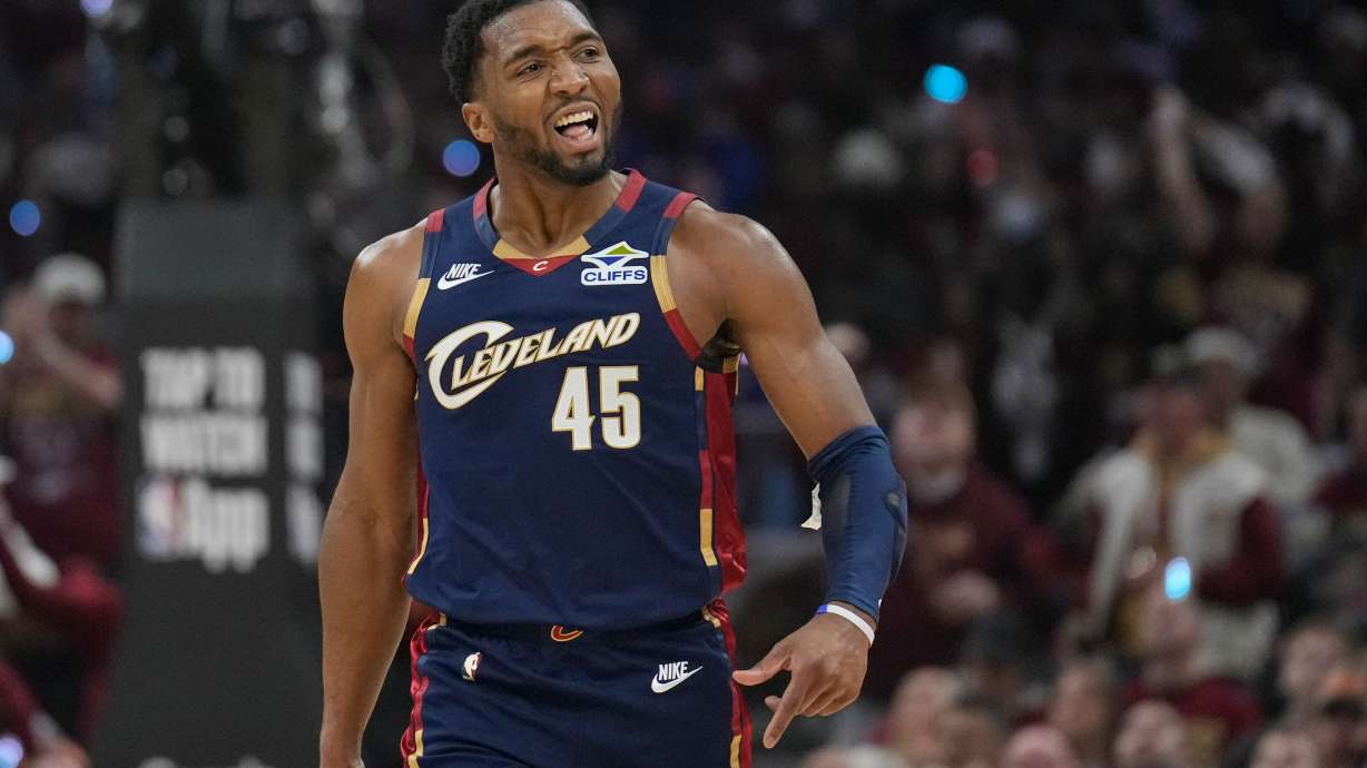 Cleveland Cavaliers guard Donovan Mitchell (45) gestures to the crowd in the first half in Game 2 of a first-round NBA basketball playoffs series against the Toronto Raptors in Cleveland, Monday, April 20, 2026.