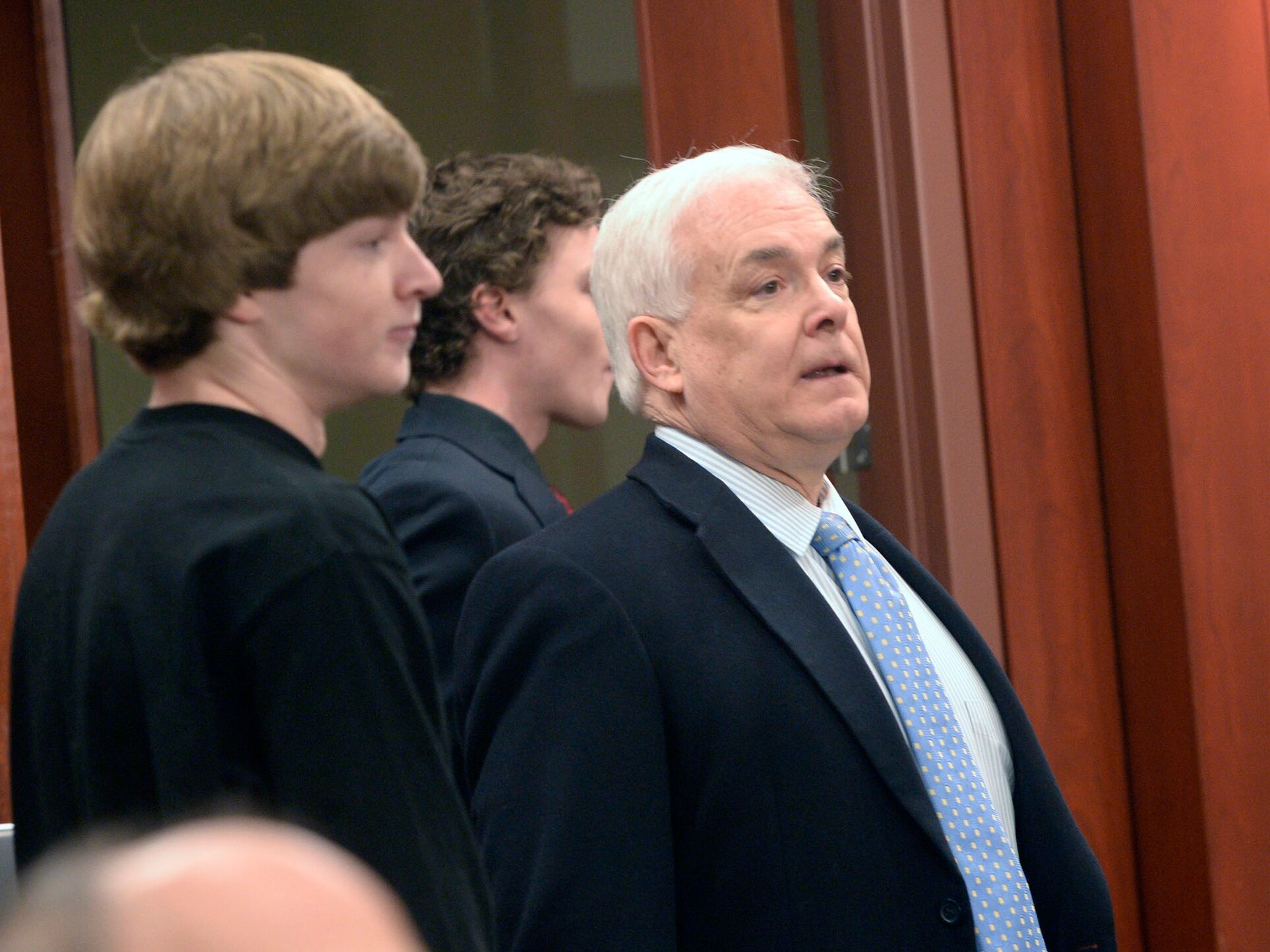 Attorney Ed Brass with his clients for an initial court appearance in Salt Lake City's 3rd District Court, March 13, 2014. Brass said he entered the criminal defense field to better understand the justice system and how to help others navigate it.