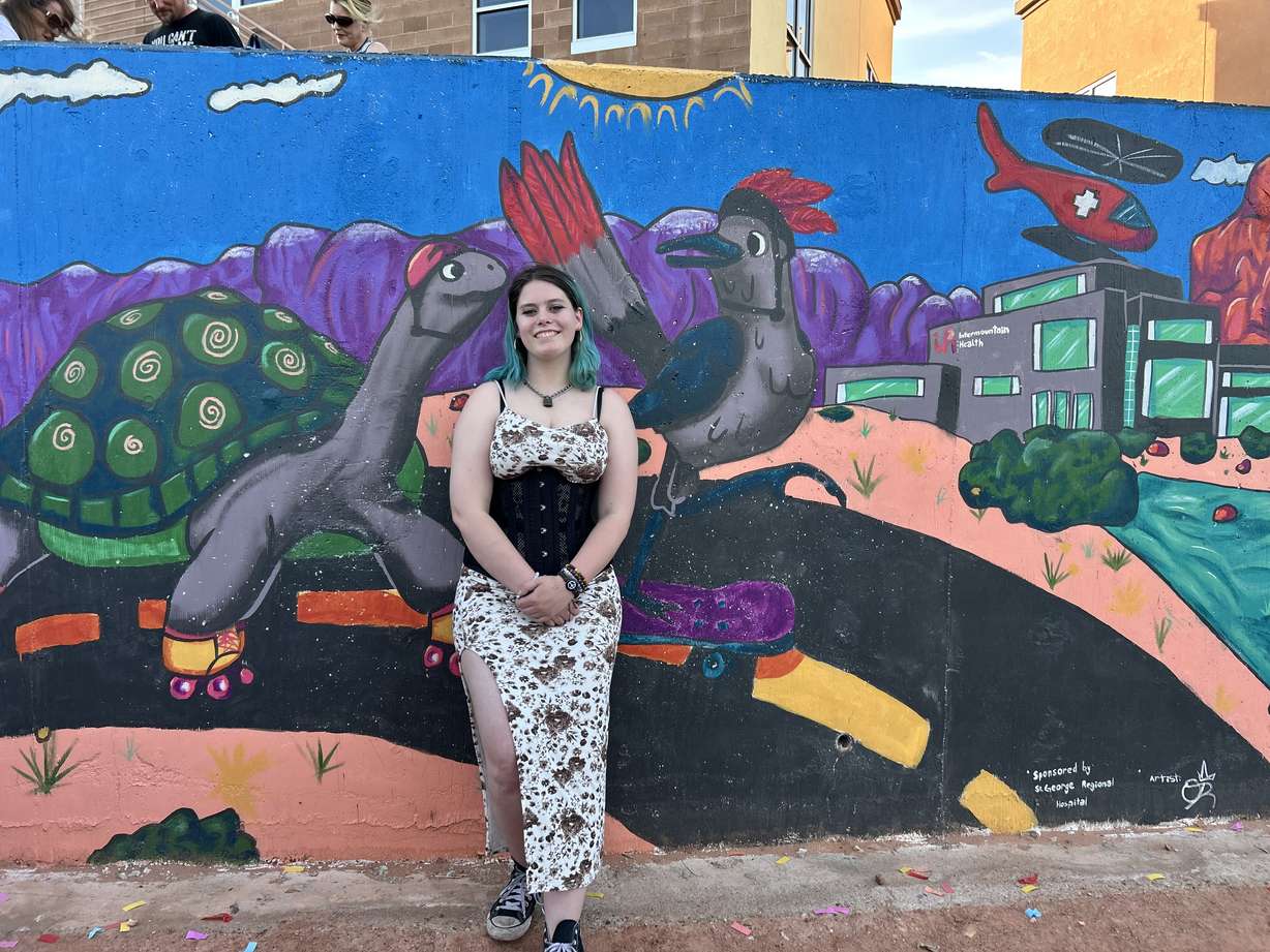 Ollie Robertson, a junior at Snow Canyon High School, is one of 20 artists who painted a 30-foot mural along the Mayor's Loop Trail in St. George.