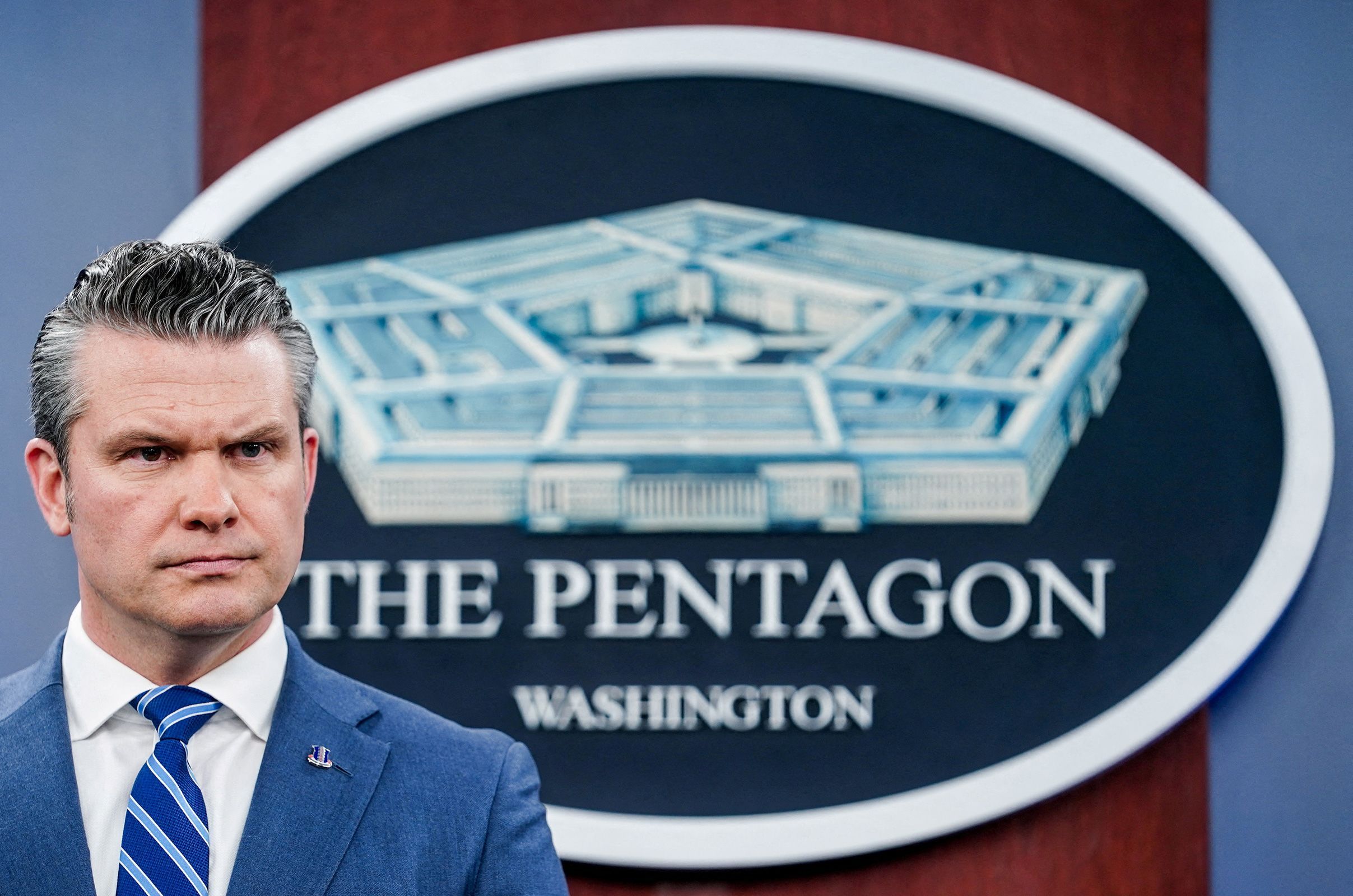 Secretary of Defense Pete Hegseth looks on during a briefing at the Pentagon on Thursday. Hegseth announced Tuesday that the military will no longer require the annual flu vaccine for troops.