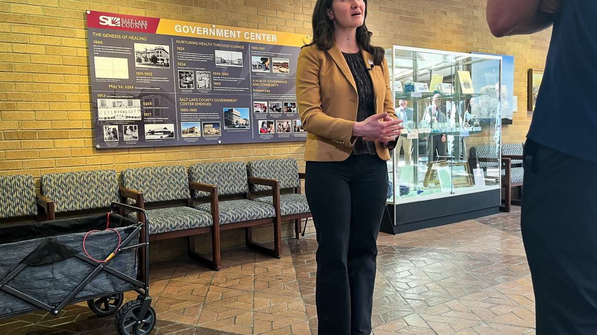 Emily Paskett speaks to reporters about the "Visualize Water in the Great Salt Lake Basin" exhibit at the Salt Lake County Government Center in Salt Lake City on Tuesday.