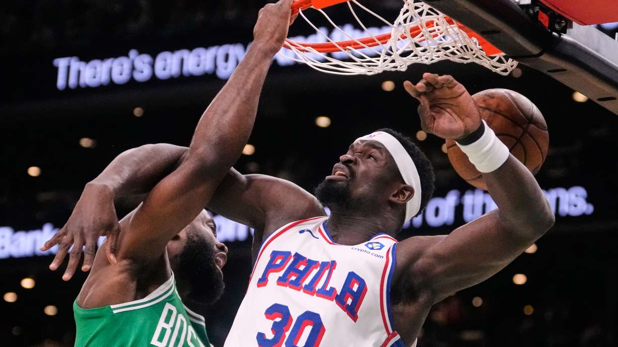 Boston Celtics guard Jaylen Brown (7) slams a dunk against Philadelphia 76ers center Adem Bona (30) during the first half of Game 2 of a first-round NBA playoffs basketball game, Tuesday, April 21, 2026, in Boston.