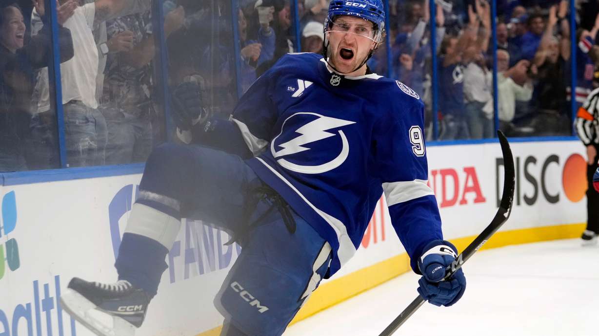 Tampa Bay Lightning defenseman J.J. Moser (90) celebrates after scoring the game-winning goal against the Montréal Canadiens during overtime in Game 2 of an NHL hockey Stanley Cup first-round playoff series, Tuesday, April 21, 2026, in Tampa, Fla.