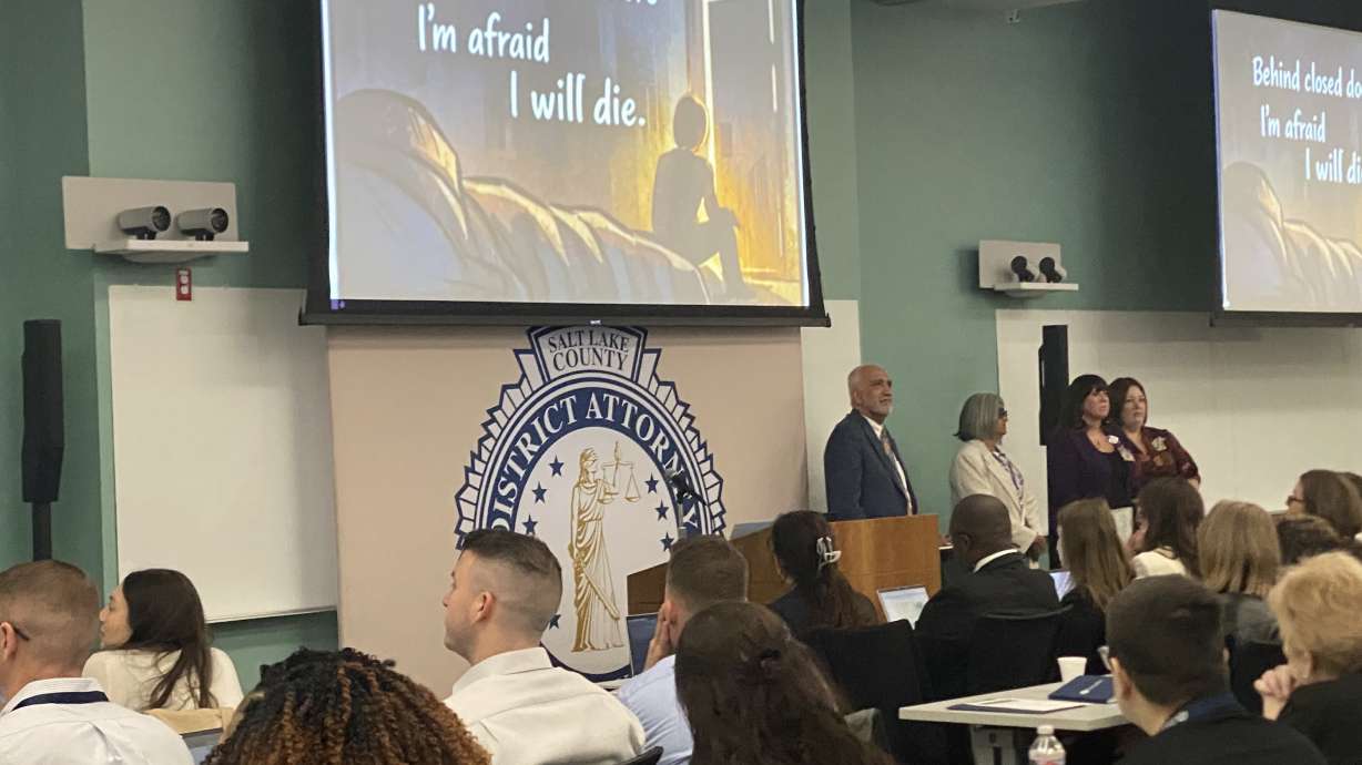 Salt Lake County District Attorney Sim Gill shares a song written by a domestic violence survivor, "Behind Close Doors," during a conference Wednesday with prosecutors from across the nation.