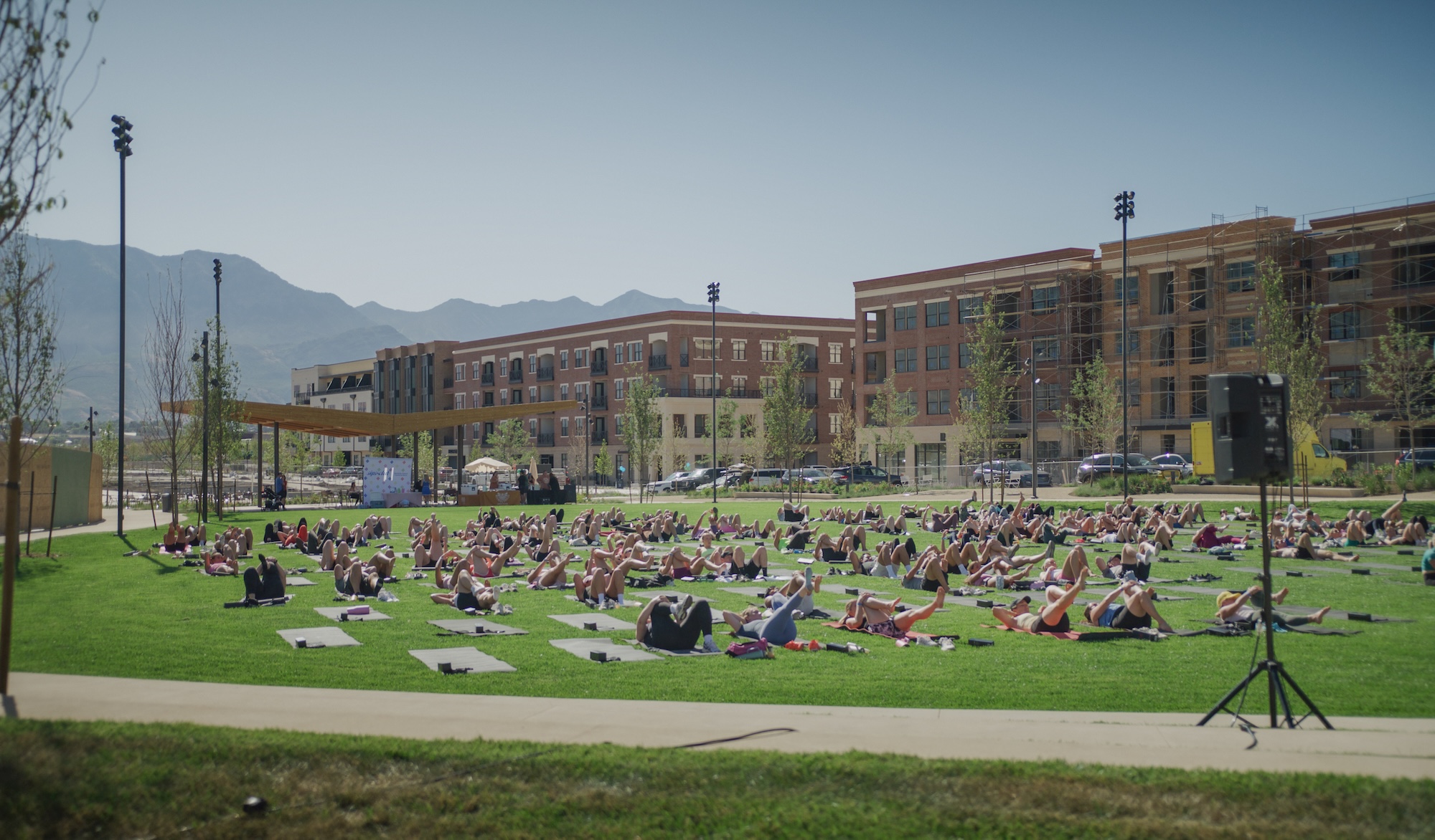 People participate in an outdoor workout class at Civic Park in Utah City, a community in Vineyard.