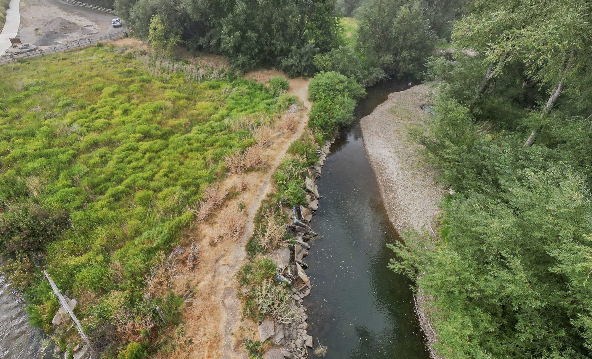 Dozens of old cars, debris pulled from Logan River in restoration project