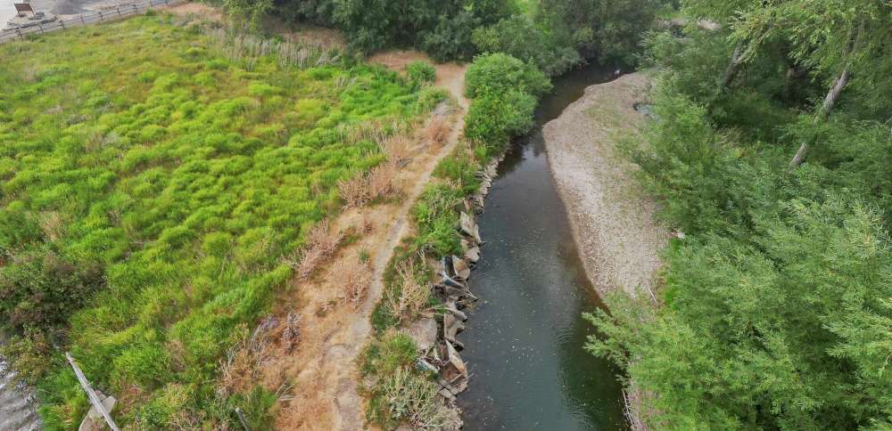 Dozens of old cars, debris pulled from Logan River in restoration project