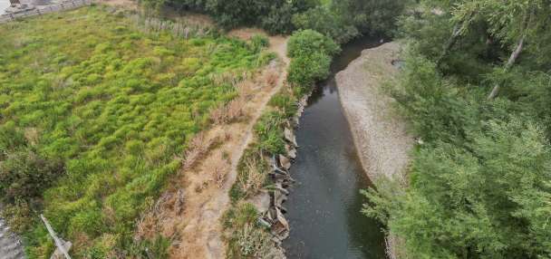 Dozens of old cars, debris pulled from Logan River in restoration project