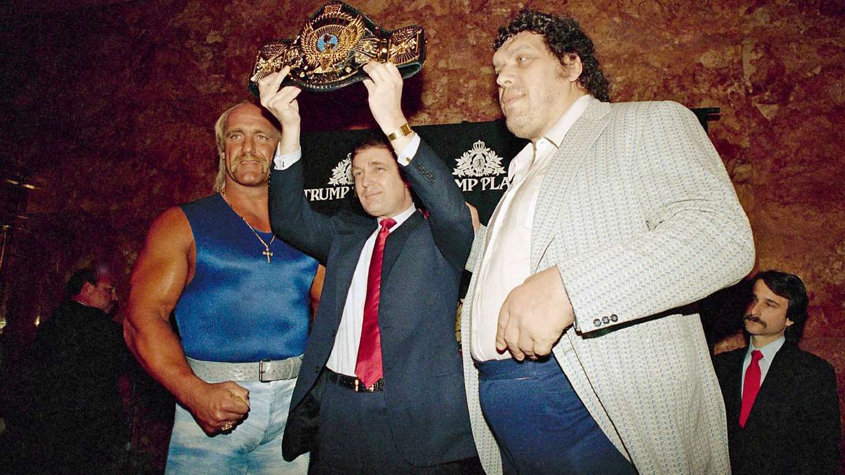 FILE - Real estate developer Donald Trump holds the World Wrestling Federation Championship belt flanked by Hulk Hogan, left, and Andre the Giant at a news conference, March 15, 1988, in New York.