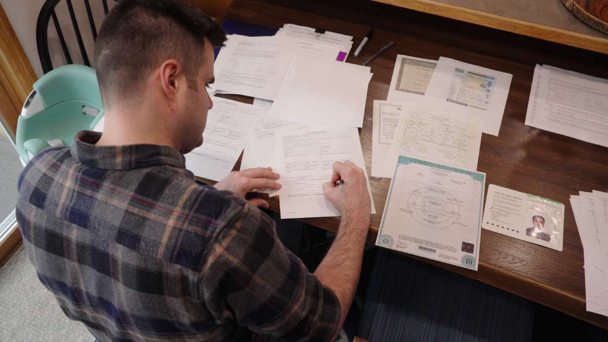This image made from video shows Zach Loud completing his application for Canadian citizenship at his family's home in Farmington, Minn., Friday.