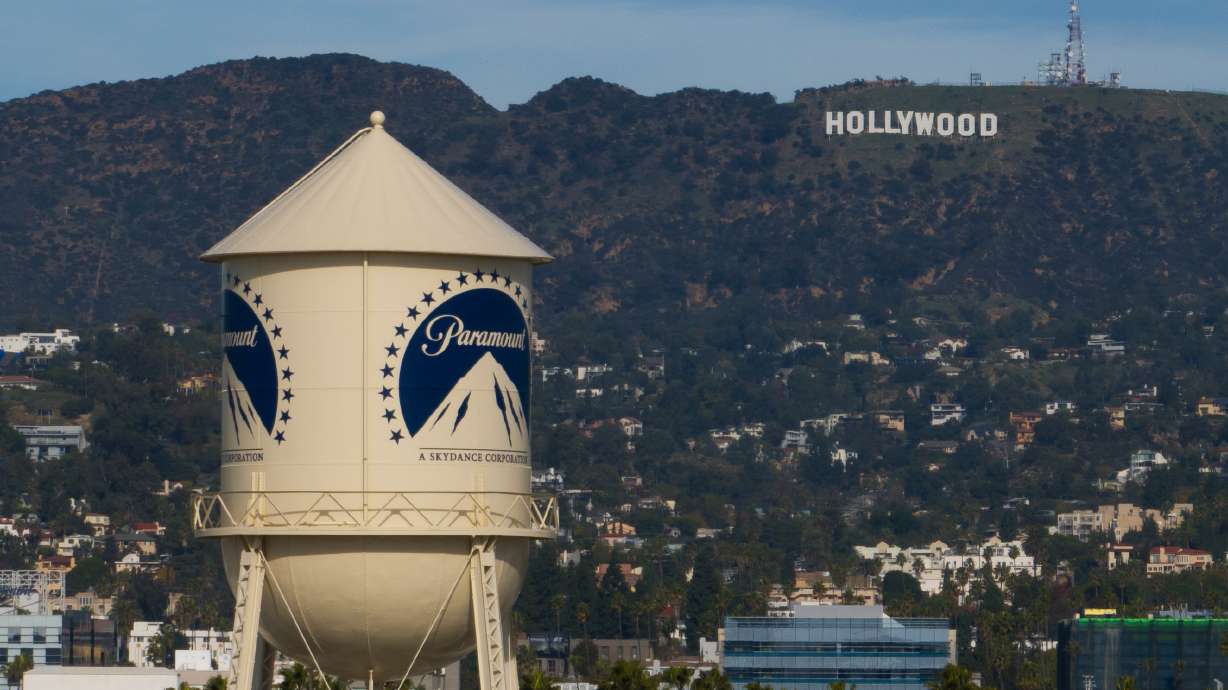 The Paramount Pictures water tower is seen in Los Angeles, Dec. 18, 2025, with the Hollywood sign in the distance. A Warner-Paramount mega merger has received shareholders' stamp of approval.