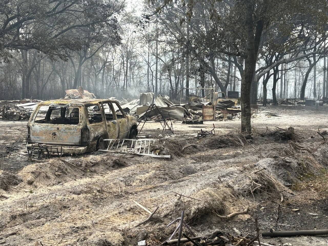 Southern US wildfires force residents to flee, leaving them unsure if their homes are standing