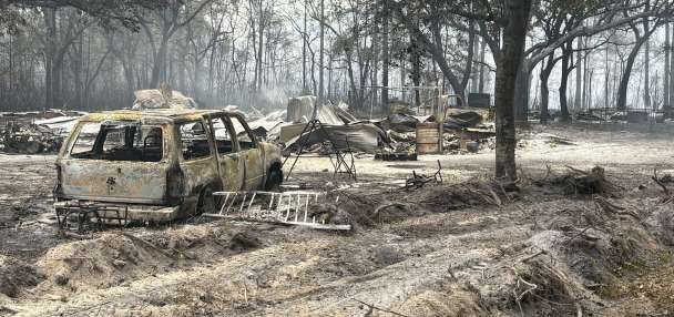 Southern US wildfires force residents to flee, leaving them unsure if their homes are standing