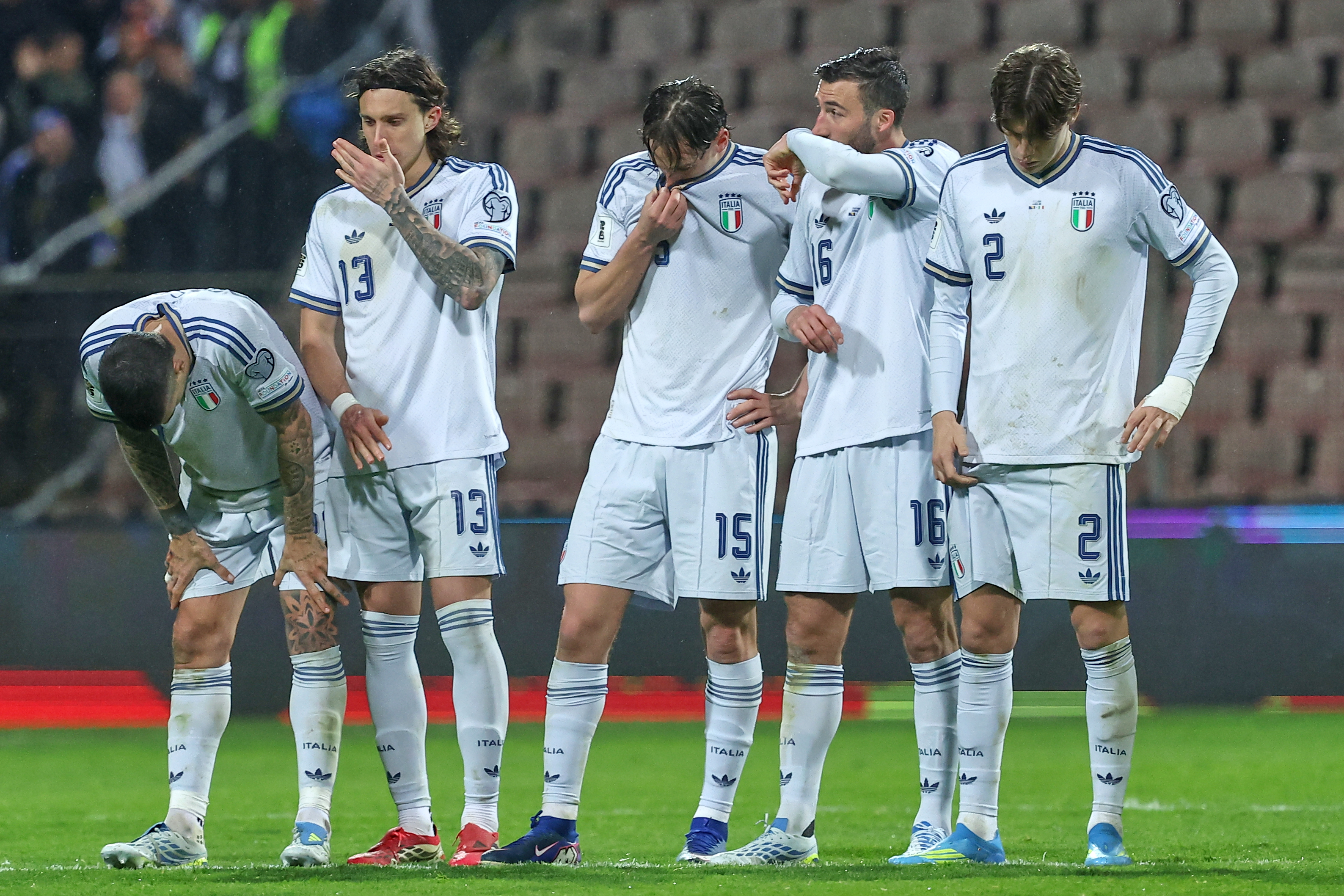Italy players react during a penalty shootout during the World Cup qualifying playoff final soccer match between Bosnia and Italy in Zenica, Bosnia, Tuesday, March 31, 2026. 