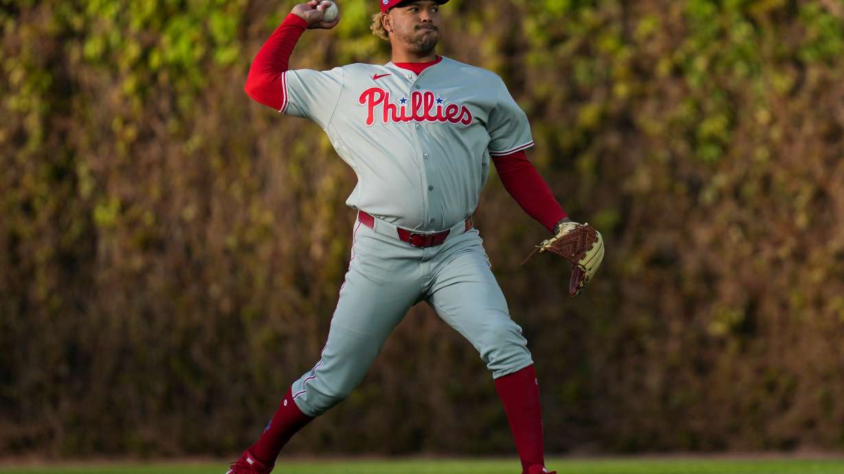 Philadelphia Phillies pitcher Taijuan Walker (99) warms up before a baseball game against the Chicago Cubs, Wednesday, April 22, 2026, in Chicago.