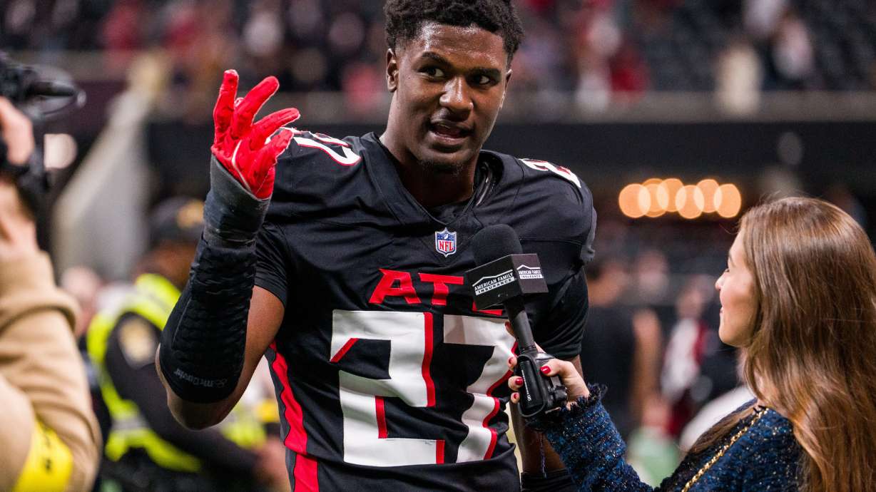FILE - Atlanta Falcons linebacker James Pearce Jr. (27) is interviewed after an NFL football game against the New Orleans Saints, Jan. 4, 2026, in Atlanta.