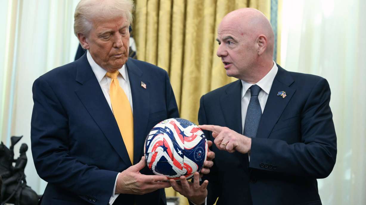 FILE - FIFA President Gianni Infantino, right, presents President Donald Trump with the new FIFA Club World Cup official ball in the Oval Office of the White House in Washington, March 7, 2025.