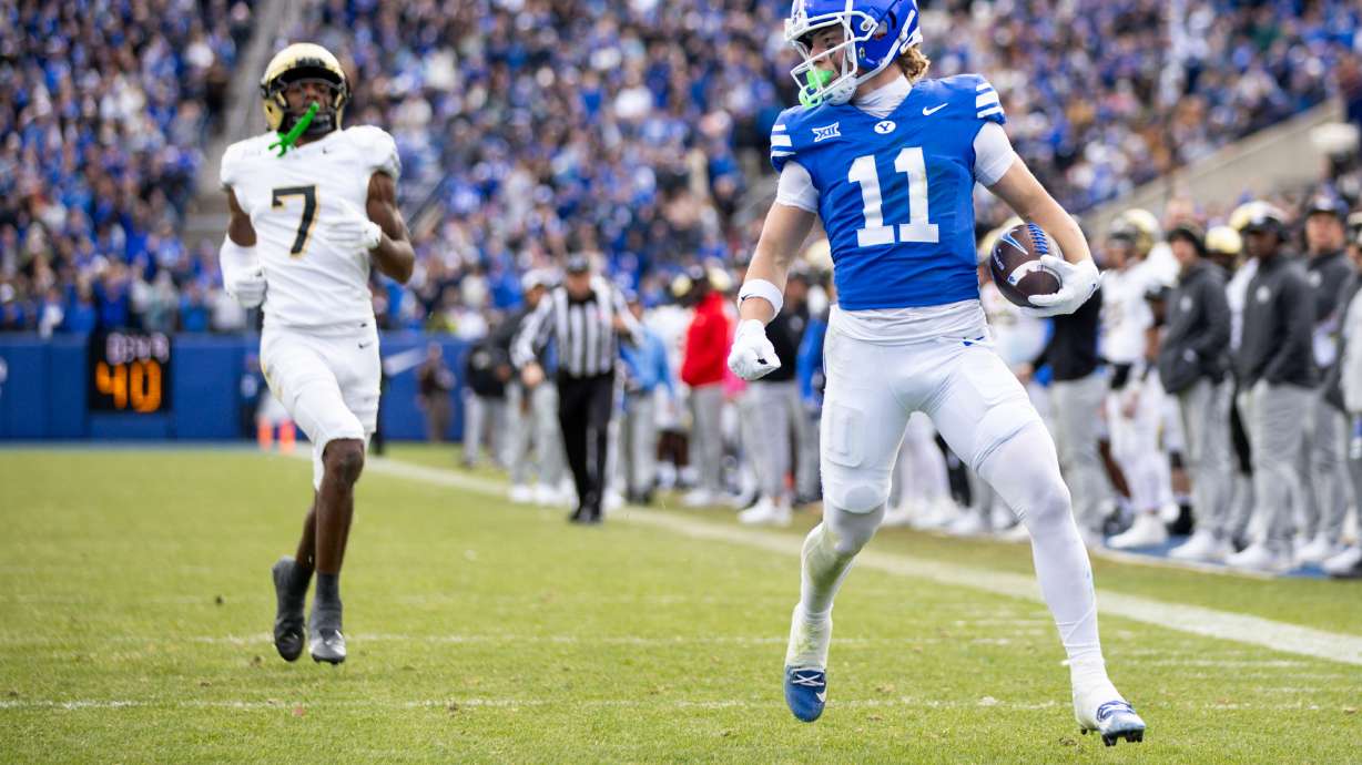 BYU wide receiver Parker Kingston (11) looks back as he scores a touchdown during the second half of the game against the UCF Knights at LaVell Edwards Stadium in Provo on Nov. 29, 2025.