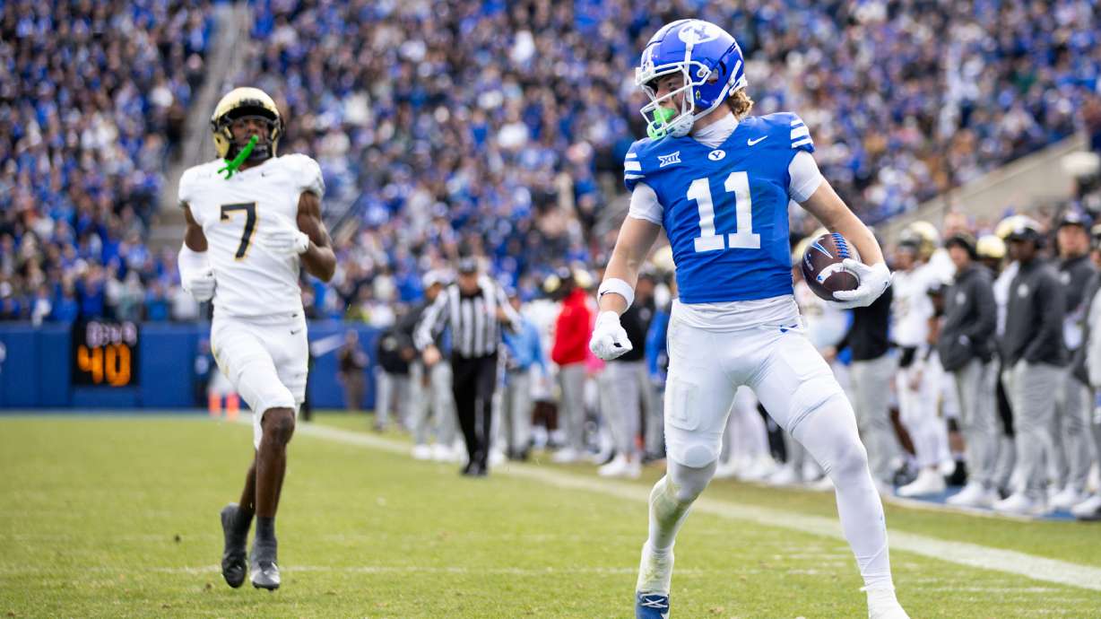 BYU wide receiver Parker Kingston (11) looks back as he scores a touchdown during the second half of the game against the UCF Knights at LaVell Edwards Stadium in Provo on Nov. 29, 2025.