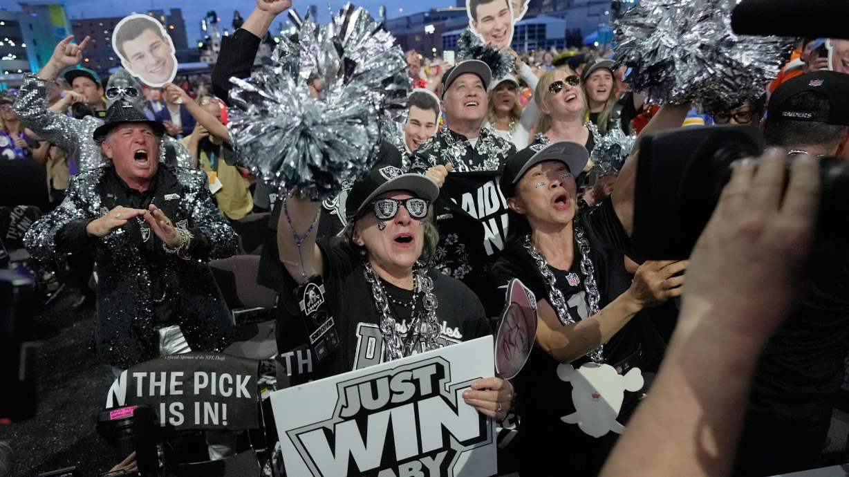 Las Vegas Raiders fans celebrate after Indiana quarterback Fernando Mendoza was chosen by the Las Vegas Raiders with the first overall pick during the first round of the NFL football draft, Thursday, April 23, 2026, in Pittsburgh.