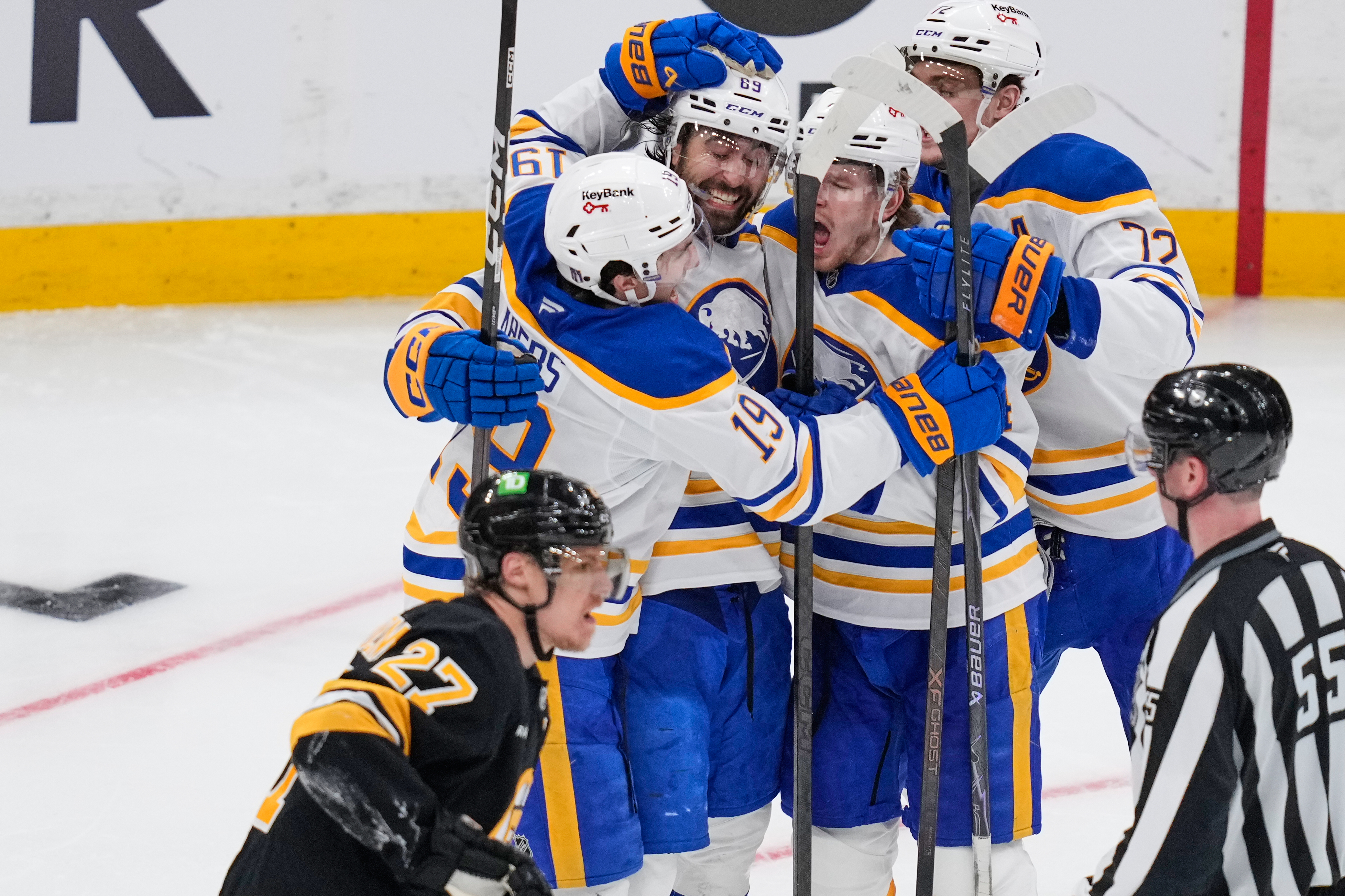 Buffalo Sabres right wing Alex Tuch (89) celebrates his goal with teammates as Boston Bruins defenseman Hampus Lindholm (27) skates past during the third period in Game 3 of a first-round NHL hockey Stanley Cup playoff series, Thursday, April 23, 2026, in Boston. 