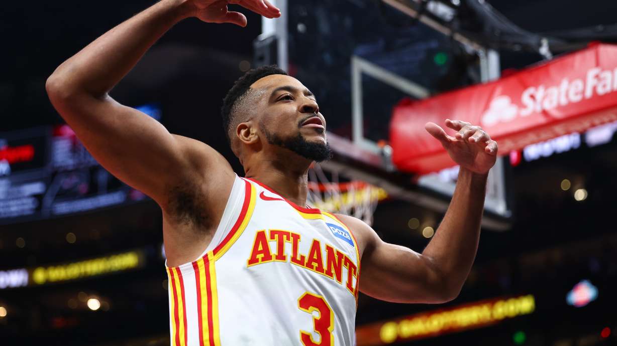 Atlanta Hawks guard CJ McCollum (3) reacts to the crowd during the first half in Game 3 of a first-round NBA playoffs basketball series against the New York Knicks, Thursday, April 23, 2026, in Atlanta.