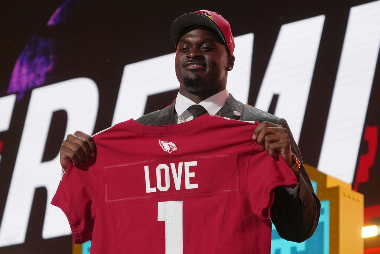 Notre Dame running back Jeremiyah Love poses after being chosen by the Arizona Cardinals with the third overall pick during the first round of the NFL football draft, Thursday, April 23, 2026, in Pittsburgh.