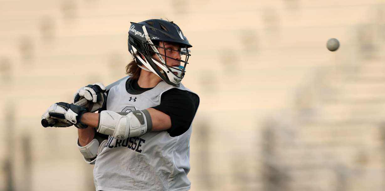 Corner Canyonâs Mason Quick flips a shot behind his head during a lacrosse practice in Draper on Wednesday, April 20, 2022.