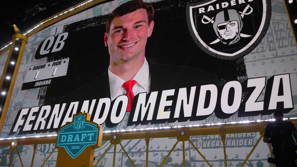 Indiana quarterback Fernando Mendoza is shown on a screen after being chosen by the Las Vegas Raiders with the first overall pick during the first round of the NFL football draft, Thursday, April 23, 2026, in Pittsburgh.