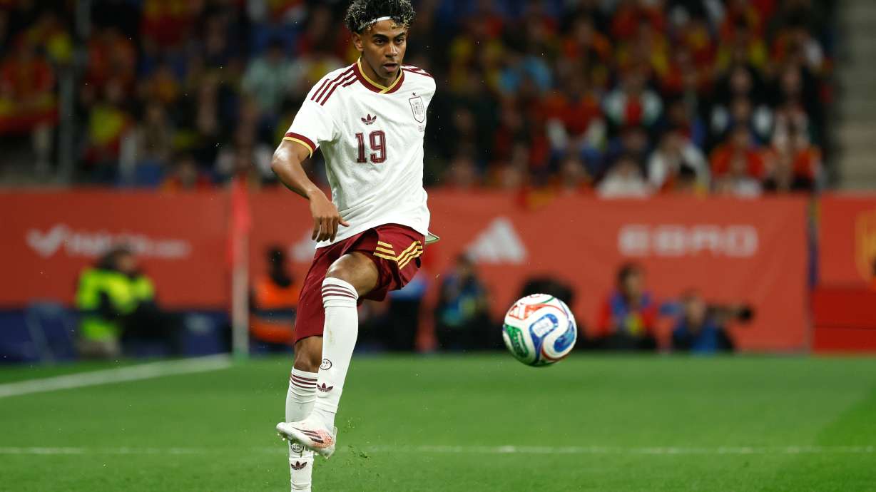 FILE - Spain's Lamine Yamal controls the ball during the international friendly soccer match between Spain and Egypt in Barcelona, Spain, March 31, 2026.