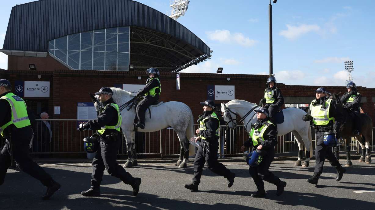 FILE - Mounted police patrols the streets around the stadium ahead of the English FA Cup soccer match between Crystal Palace and Millwall at Selhurst Park, London, England, Saturday, March 1, 2025.