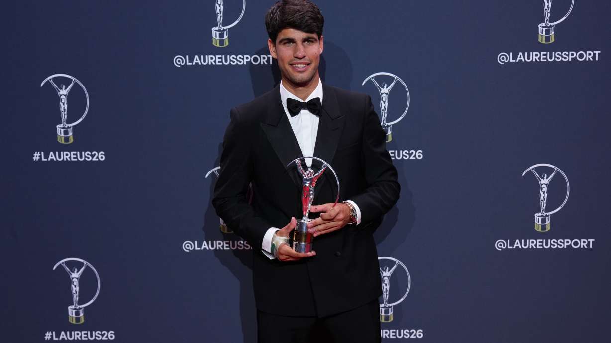 Carlos Alcaraz poses with his Laureus World Sportsman of the Year award during the 2026 Laureus World Sports Awards ceremony in Madrid, Spain, Monday, April 20, 2026.