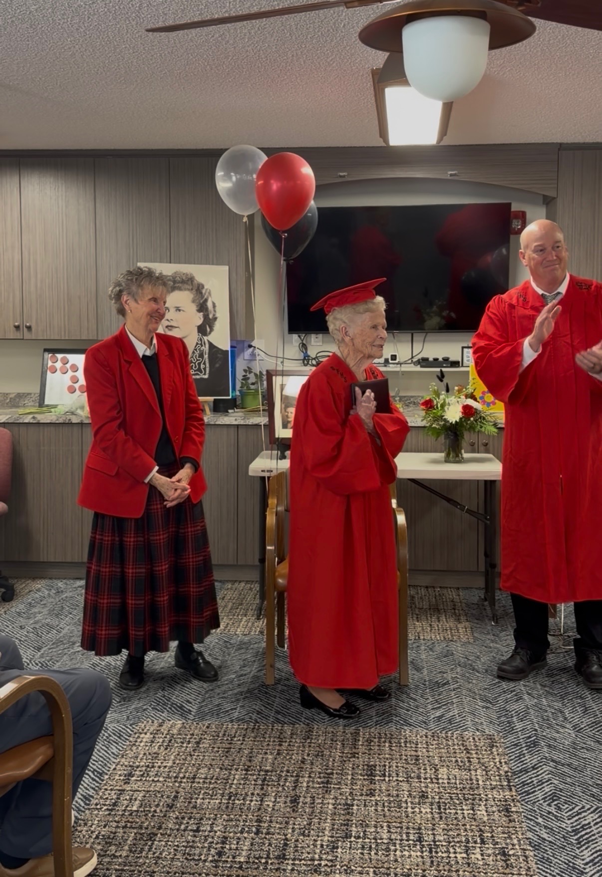 Norma Parker, of Idaho Falls, receives a high school diploma on April 9 more than 80 years after she left high school early. Superintendent Brandon Ferris and school board member Julianne Hill presented her with the diploma.